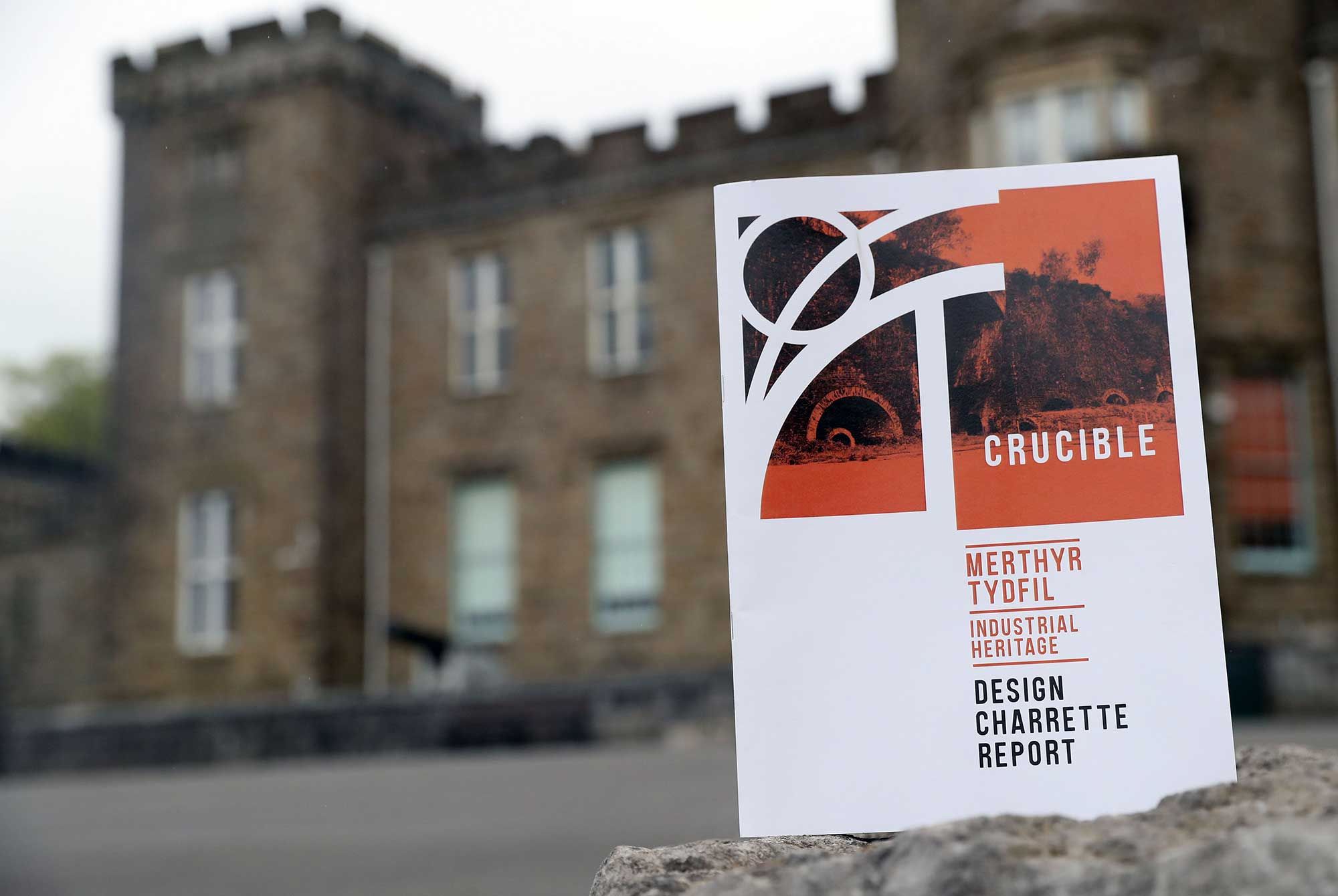 A white document with Crucible written on the front of the castle which is out of focus.jpg