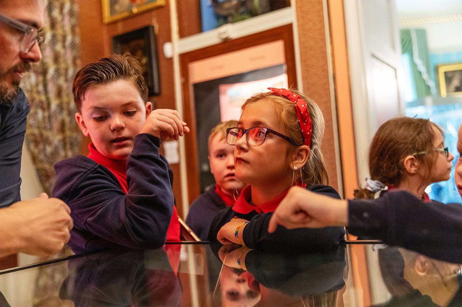 Children wearing school red and black school uniform.jpg Children wearing school red and black school uniform.jpg